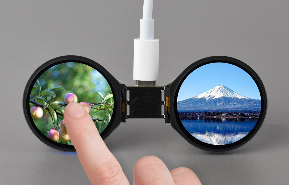 手指触摸ESP32-S3-DualEye-Touch-LCD-1.28开发板的屏幕，界面显示LVGL GUI开发出来的场景